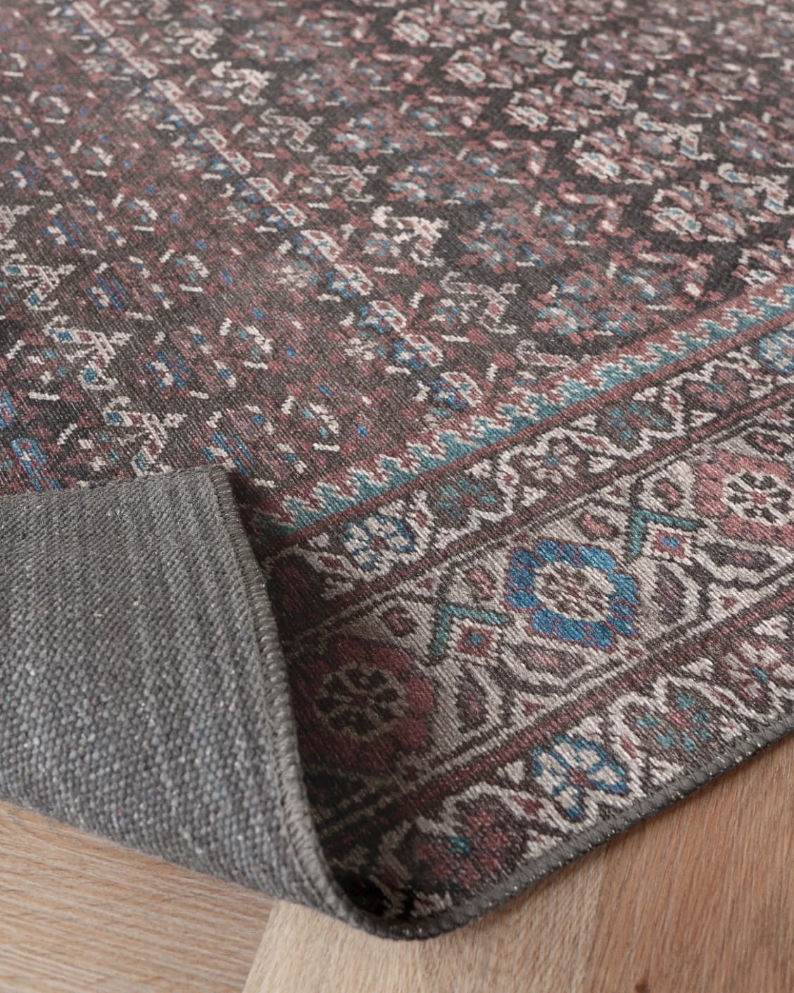 Vincent Umber carpet in red, blue and multicolour, shown in a product close-up as image 25