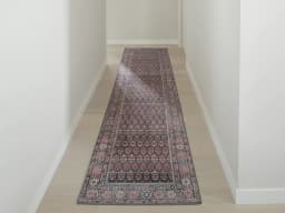 Vincent Umber Runners carpet in red, blue and multicolour, shown in a lifestyle front view