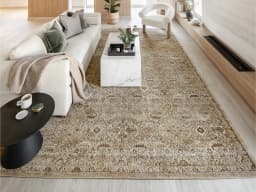 Warren Clay carpet in clay, brown and beige, shown in a lifestyle front view