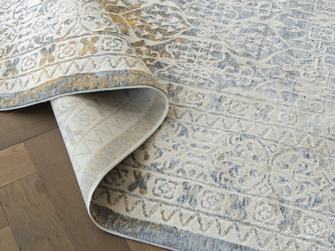 William Sandy carpets in sandy, beige, yellow and grey, shown in a product close-up view