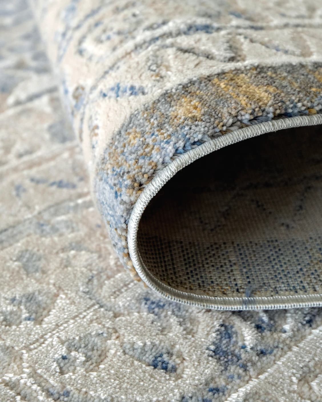 William Sandy carpet in beige, yellow and grey, shown in a product close-up as image 9