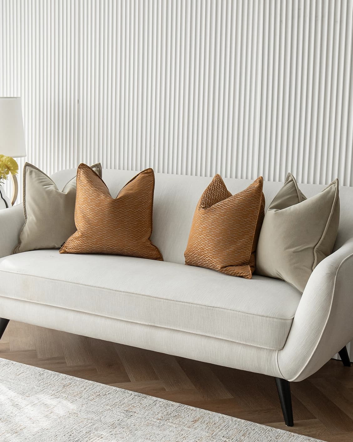 Yabella Bundle cushion in grey and orange, shown in a product right view as image 2