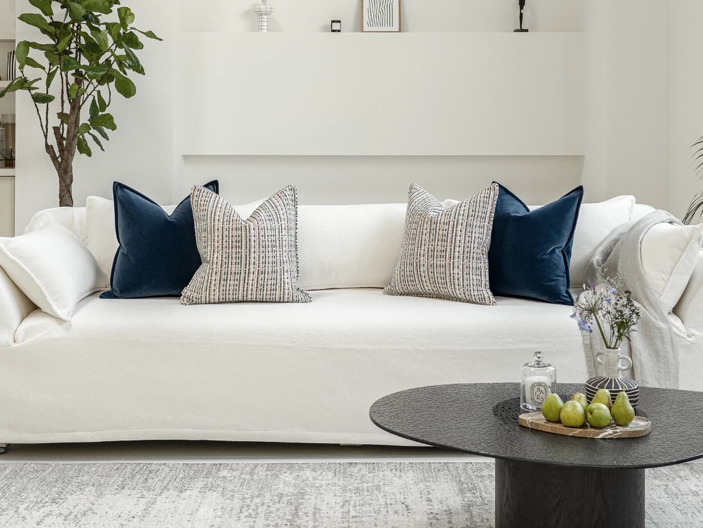 Yakshith Bundle bundle cushions in blue and cream, shown in a lifestyle front view