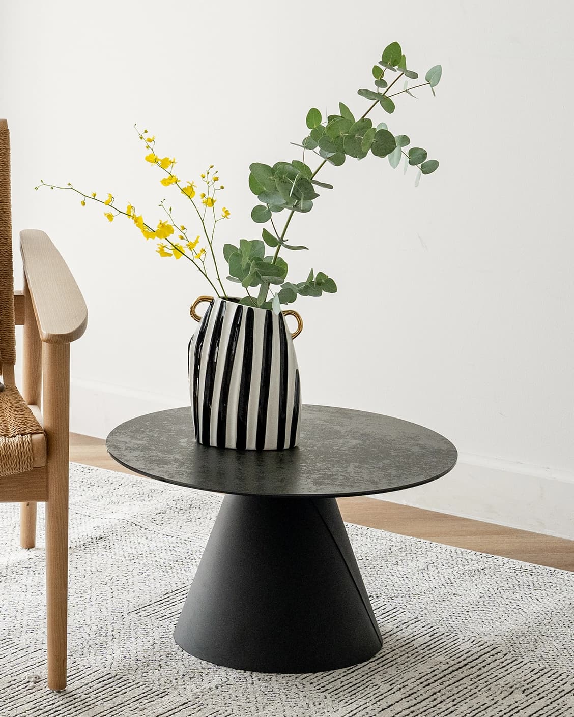 Yara Arneson vases in gold, black and white, shown in a lifestyle front view