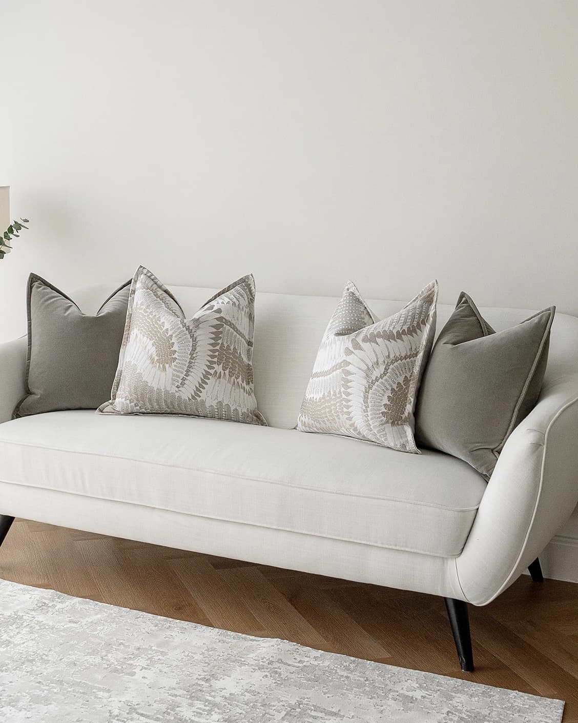 Yumi Bundle cushion in grey and brown, shown in a lifestyle right view as image 2
