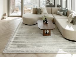 Zahra Alba carpet in ivory and grey, shown in a lifestyle front view
