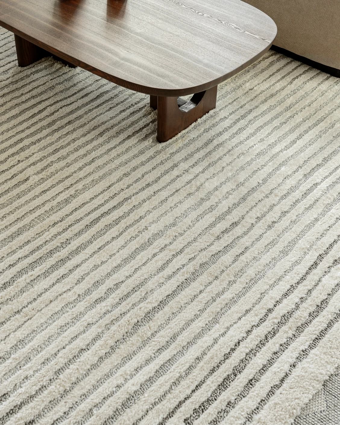 Zahra Alba carpet in ivory and grey, shown in a lifestyle top view as image 8