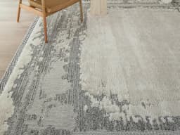 Zahra Bianca carpet in grey and ivory, shown in a lifestyle front view