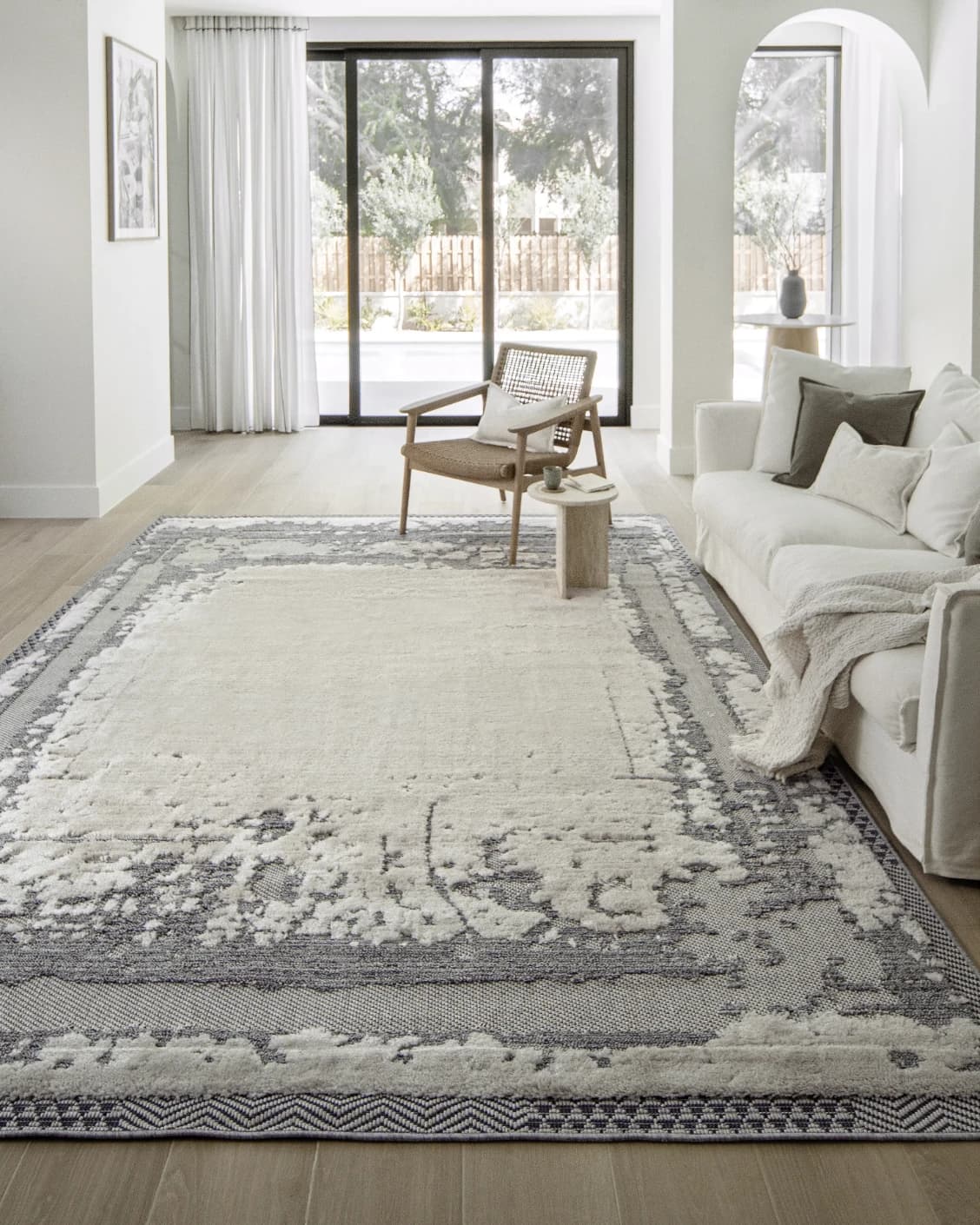 Zahra Bianca carpet in grey and ivory, shown in a lifestyle front view as image 5