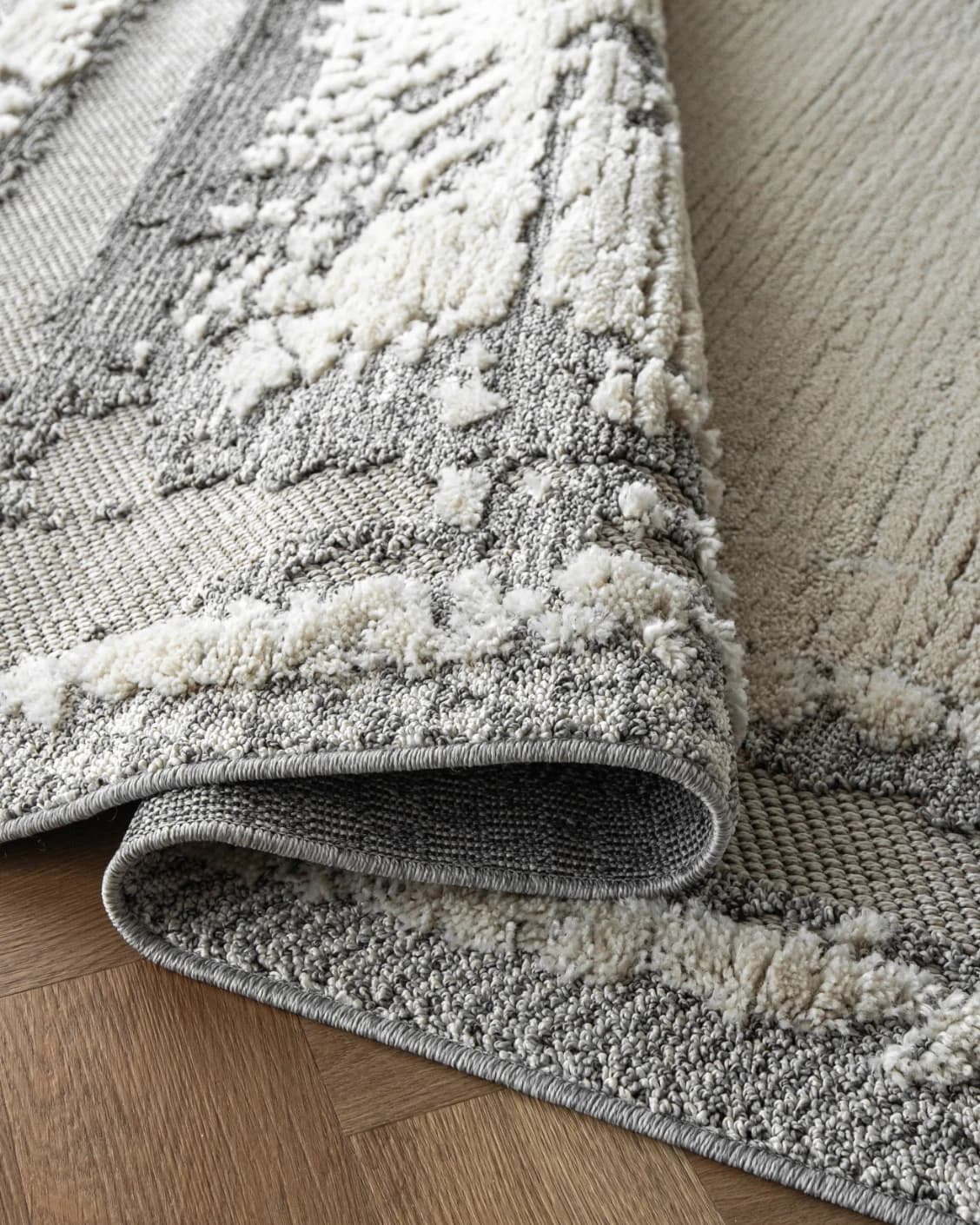 Zahra Bianca carpet in grey and ivory, shown in a product close-up as image 11