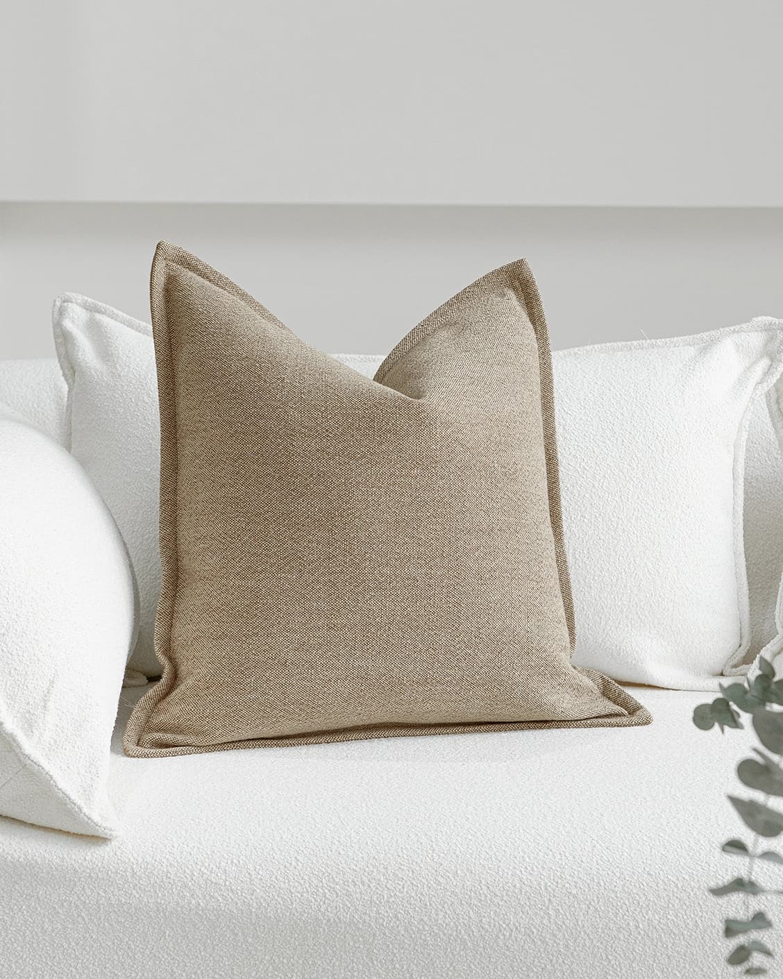 Zane Braun cushion in beige, shown in a lifestyle front view as image 2