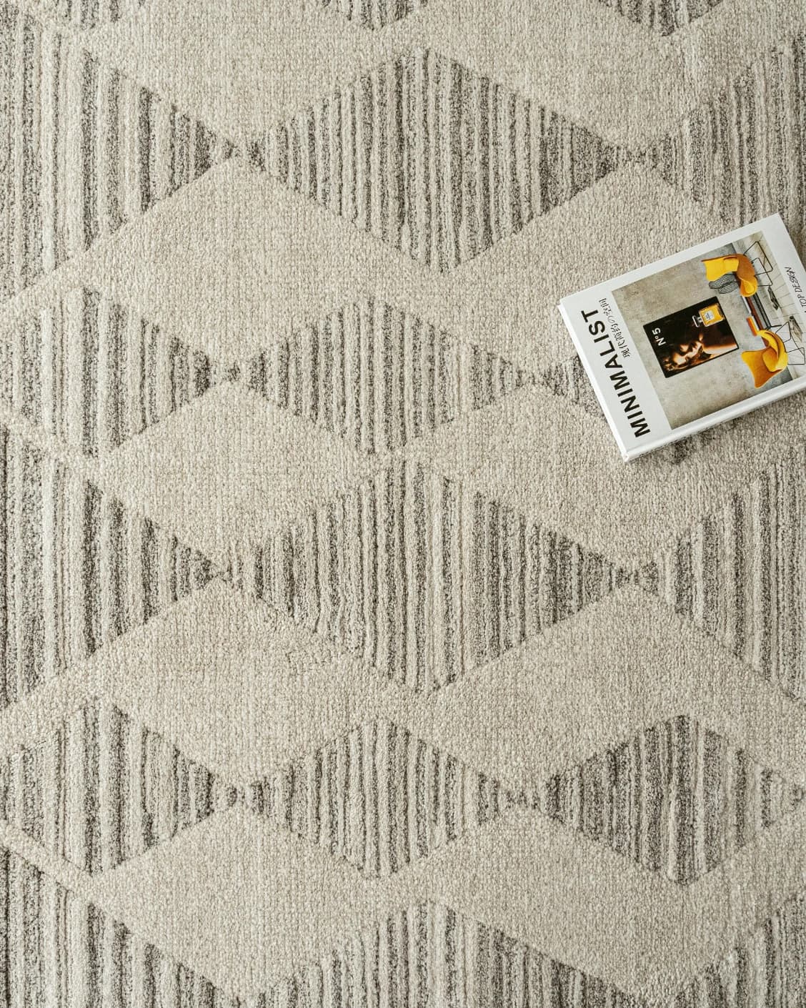 Zen Alba carpet in cream, beige and grey, shown in a lifestyle top view as image 7