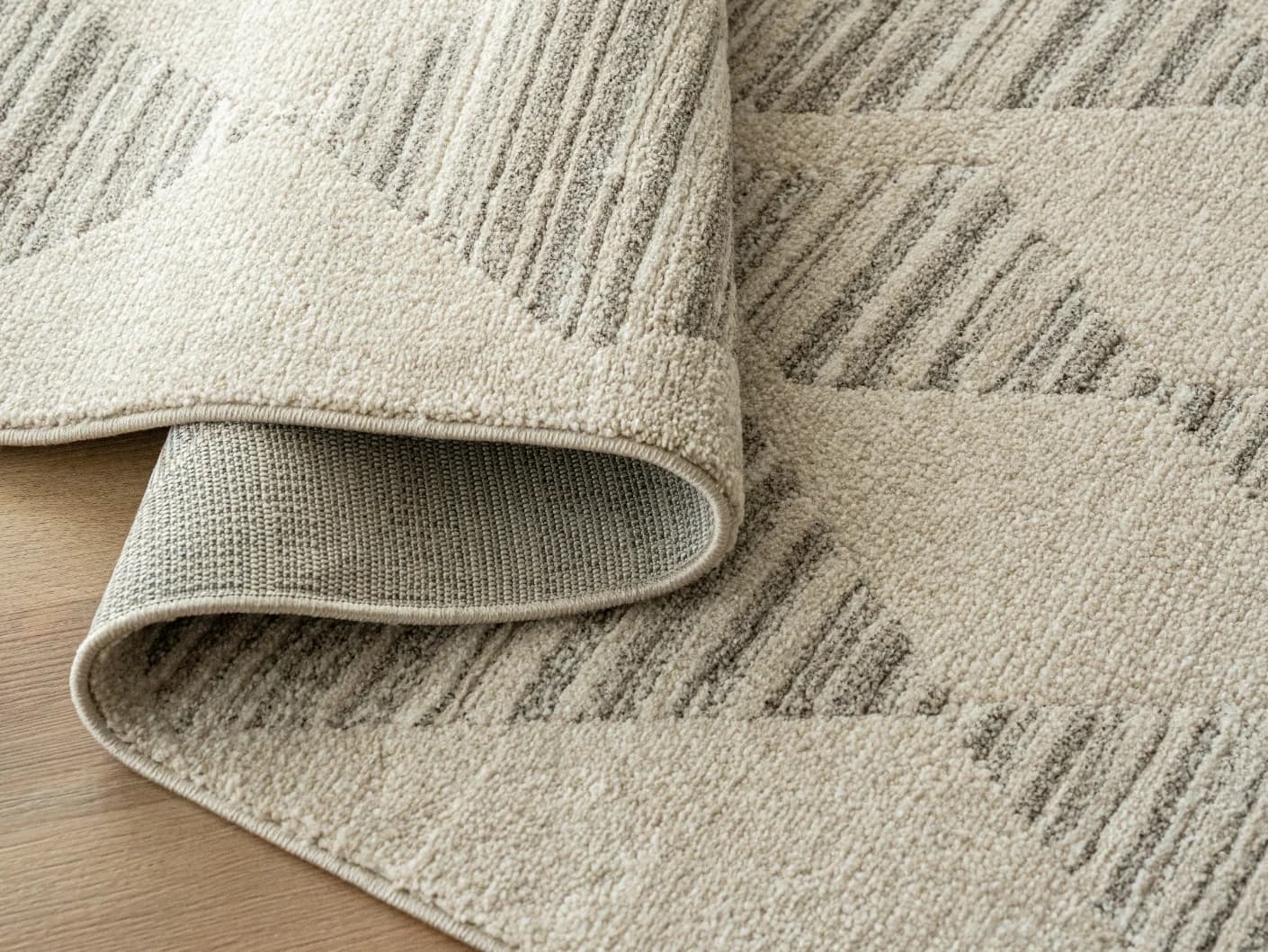 Zen Alba carpets in cream, beige and grey, shown in a product close-up view