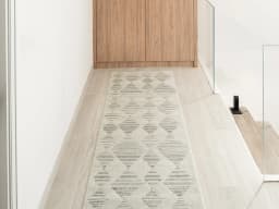 Zen Alba Runners carpet in cream, beige and grey, shown in a lifestyle front view