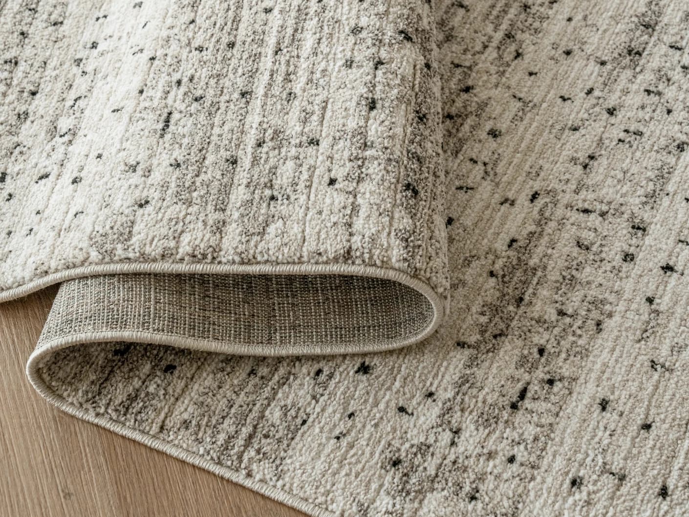 Zen Ashton Round carpets in beige, shown in a product close-up view