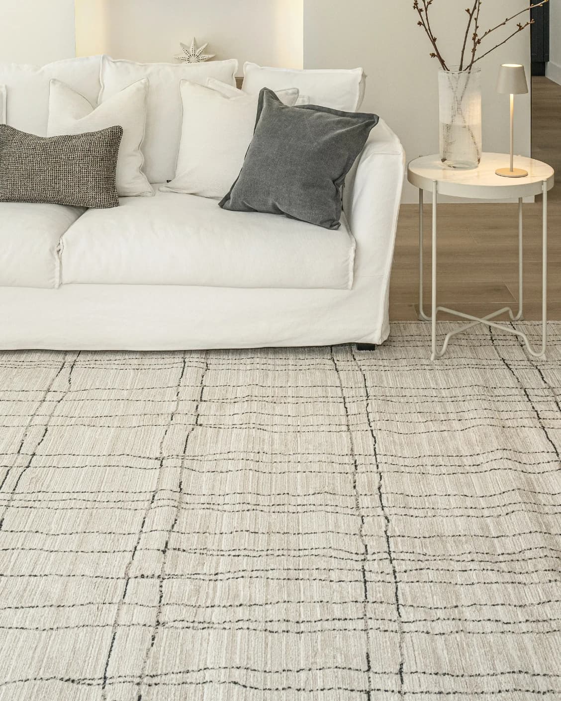 Zen Bianca carpet in charcoal and beige, shown in a lifestyle front view as image 4