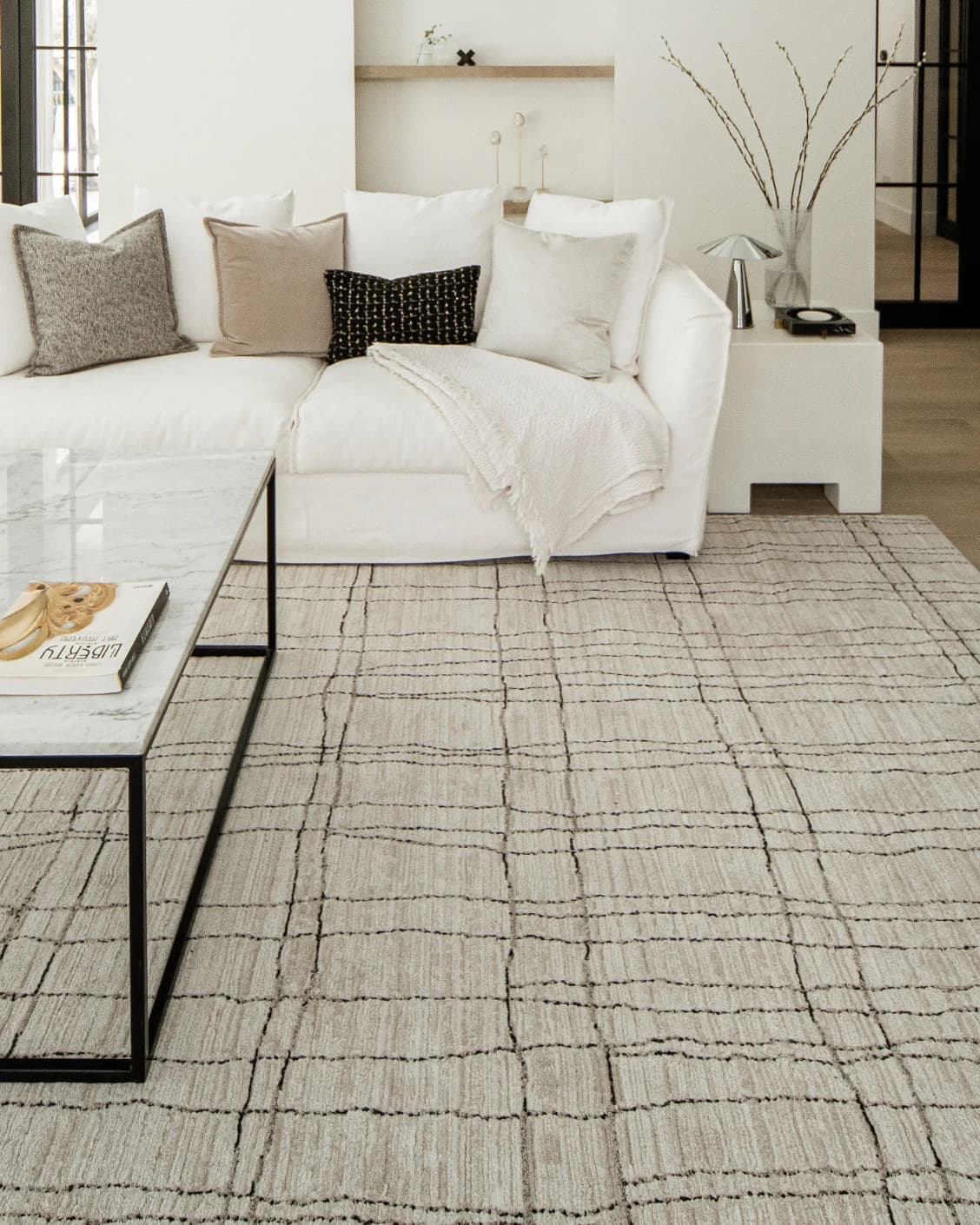 Zen Bianca carpet in charcoal and beige, shown in a lifestyle front view as image 5