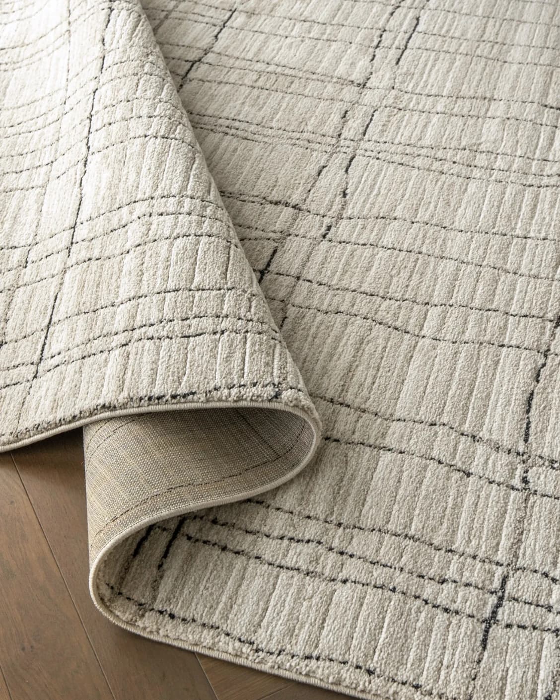 Zen Bianca carpet in charcoal and beige, shown in a product close-up as image 16