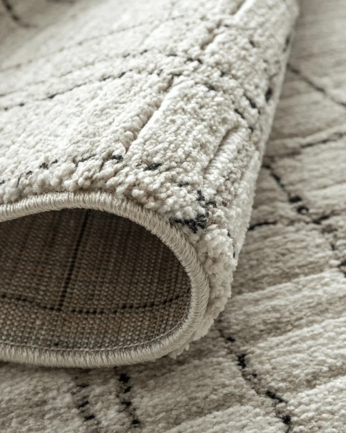 Zen Bianca carpet in charcoal and beige, shown in a product close-up as image 17