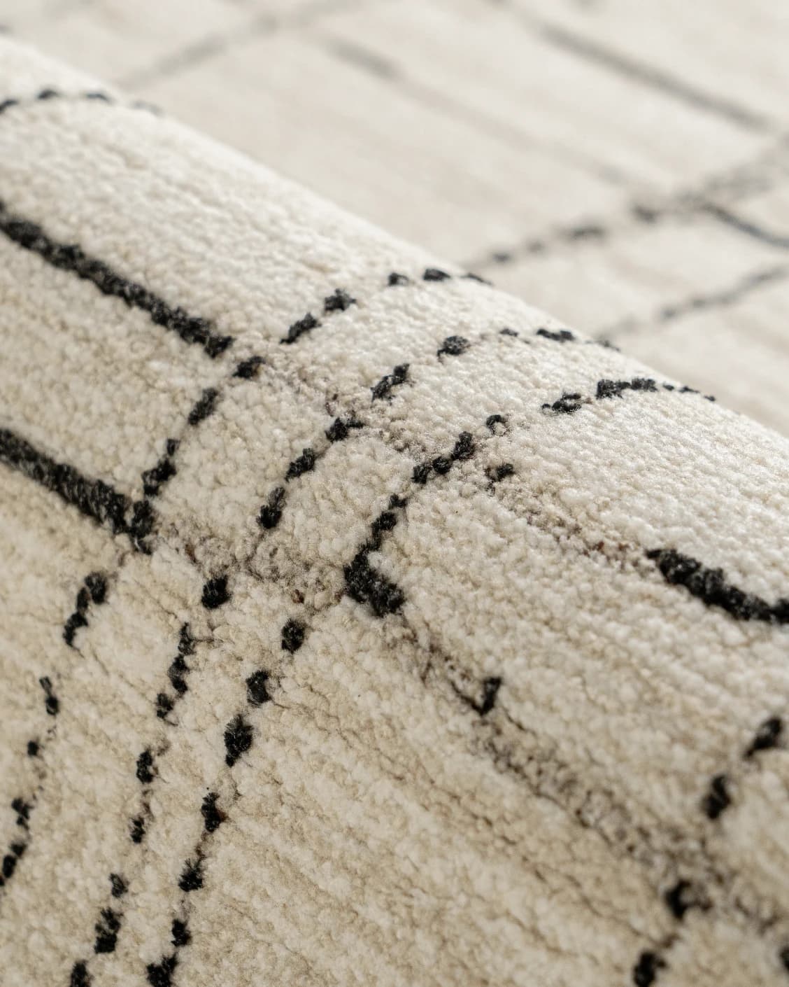 Zen Bianca carpet in charcoal and beige, shown in a product close-up as image 18