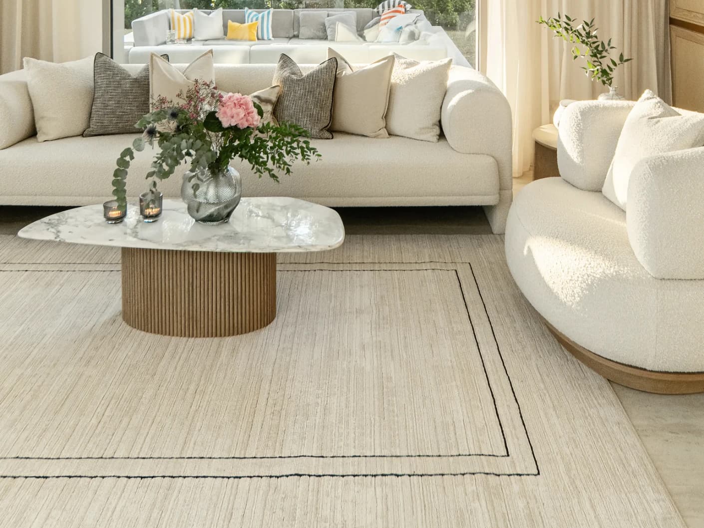 Zen Colin Round carpet in black and beige, shown in a lifestyle top view as image 4