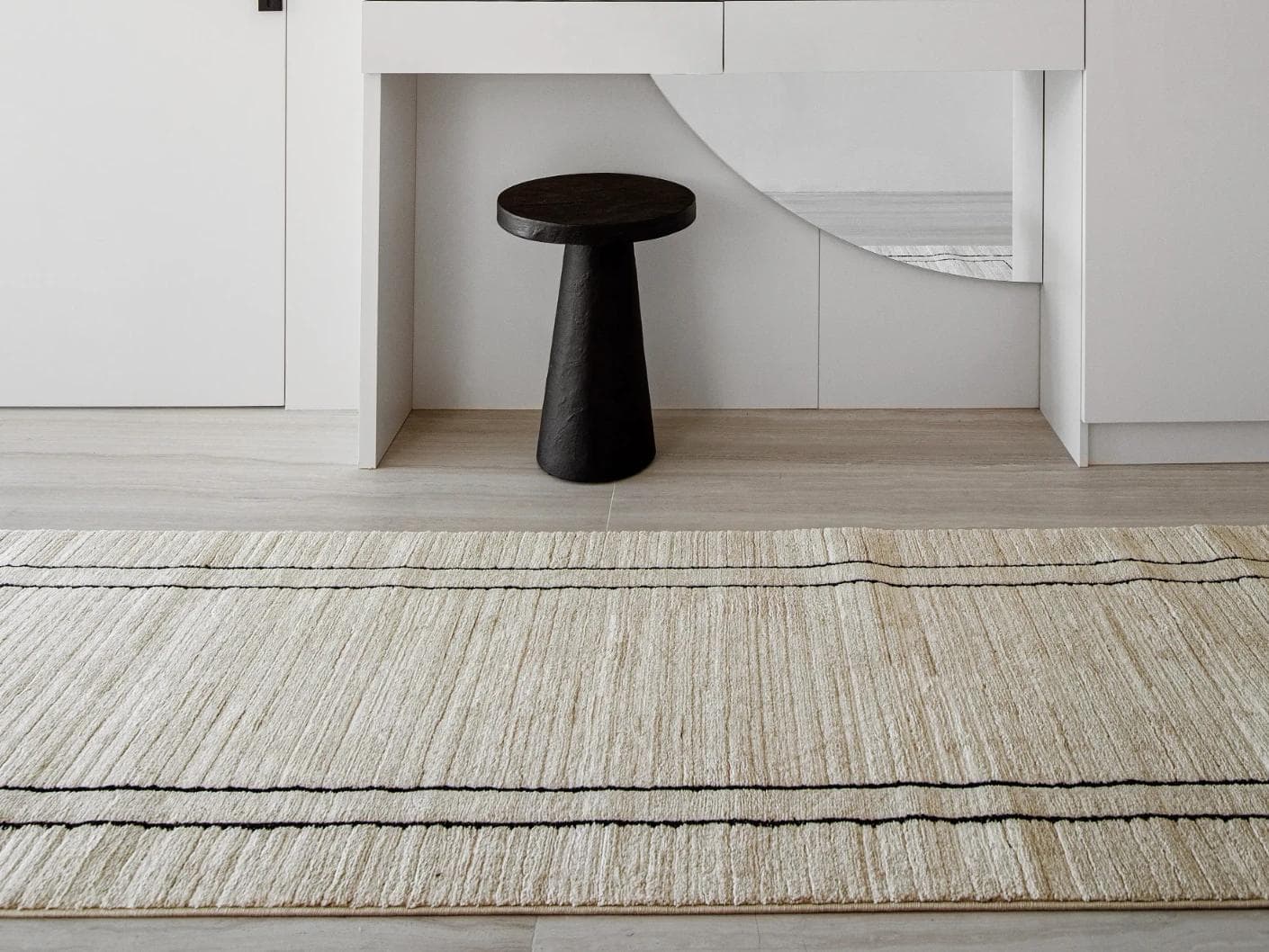 Zen Colin Runners carpet in black and beige, shown in a lifestyle front view as image 4