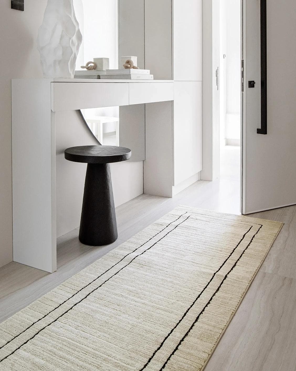 Zen Colin Runners carpet in black and beige, shown in a lifestyle left view as image 6