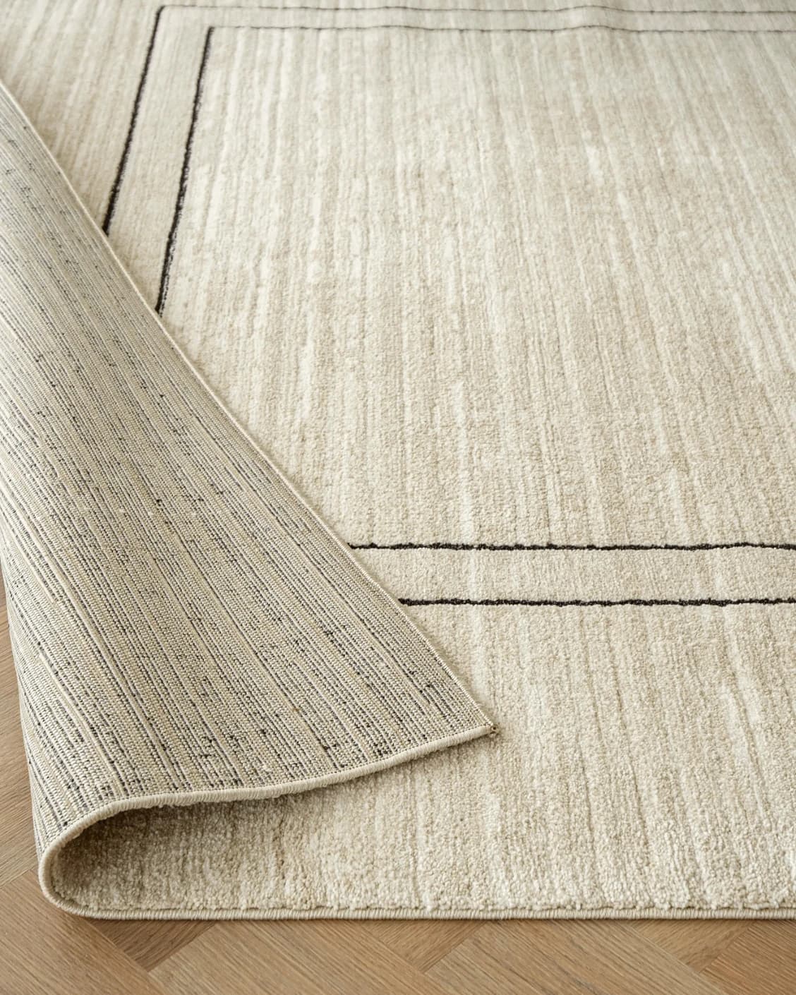 Zen Colin carpet in black and beige, shown in a product close-up as image 10