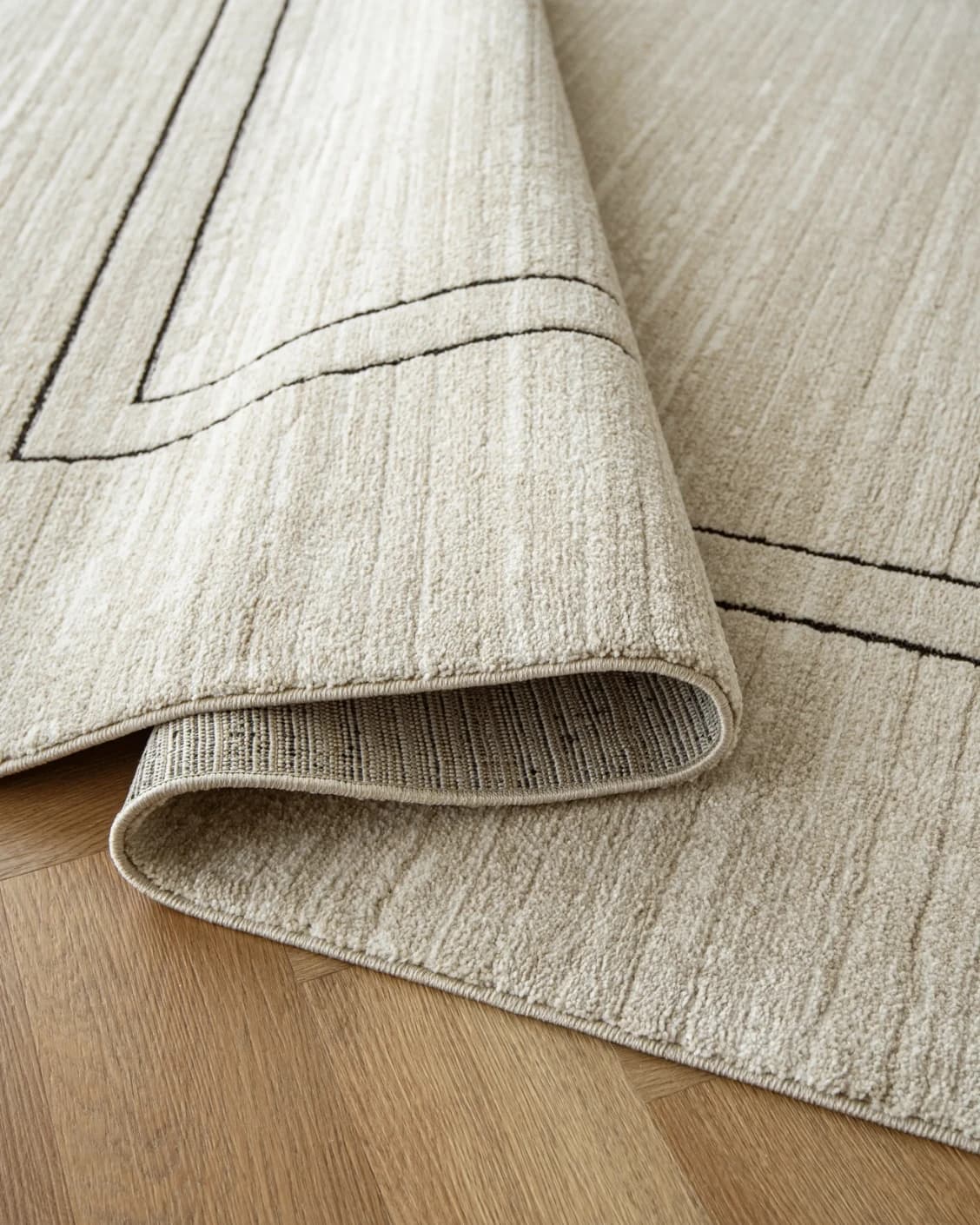 Zen Colin carpet in black and beige, shown in a product close-up as image 11