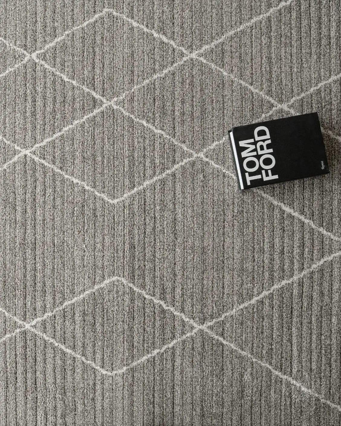 Zen Dune carpet in grey and off white, shown in a lifestyle top view as image 7