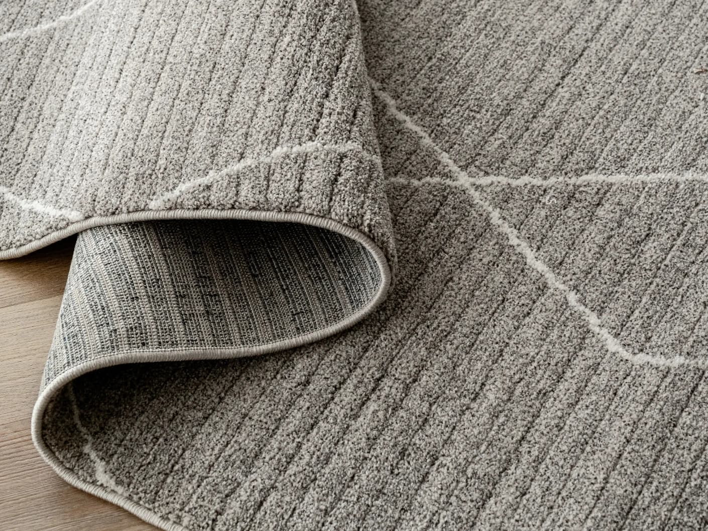 Zen Dune Runners carpets in dune, grey and off white, shown in a product close-up view