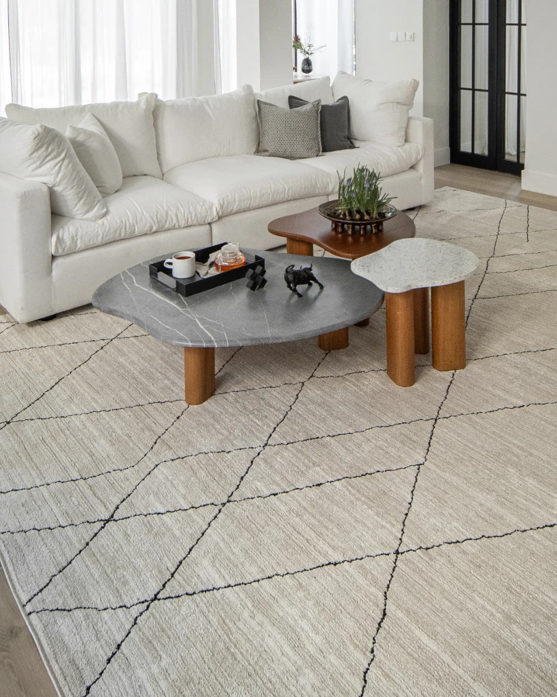 Zen Pearl carpet in charcoal and ivory, shown in a lifestyle left view as image 7