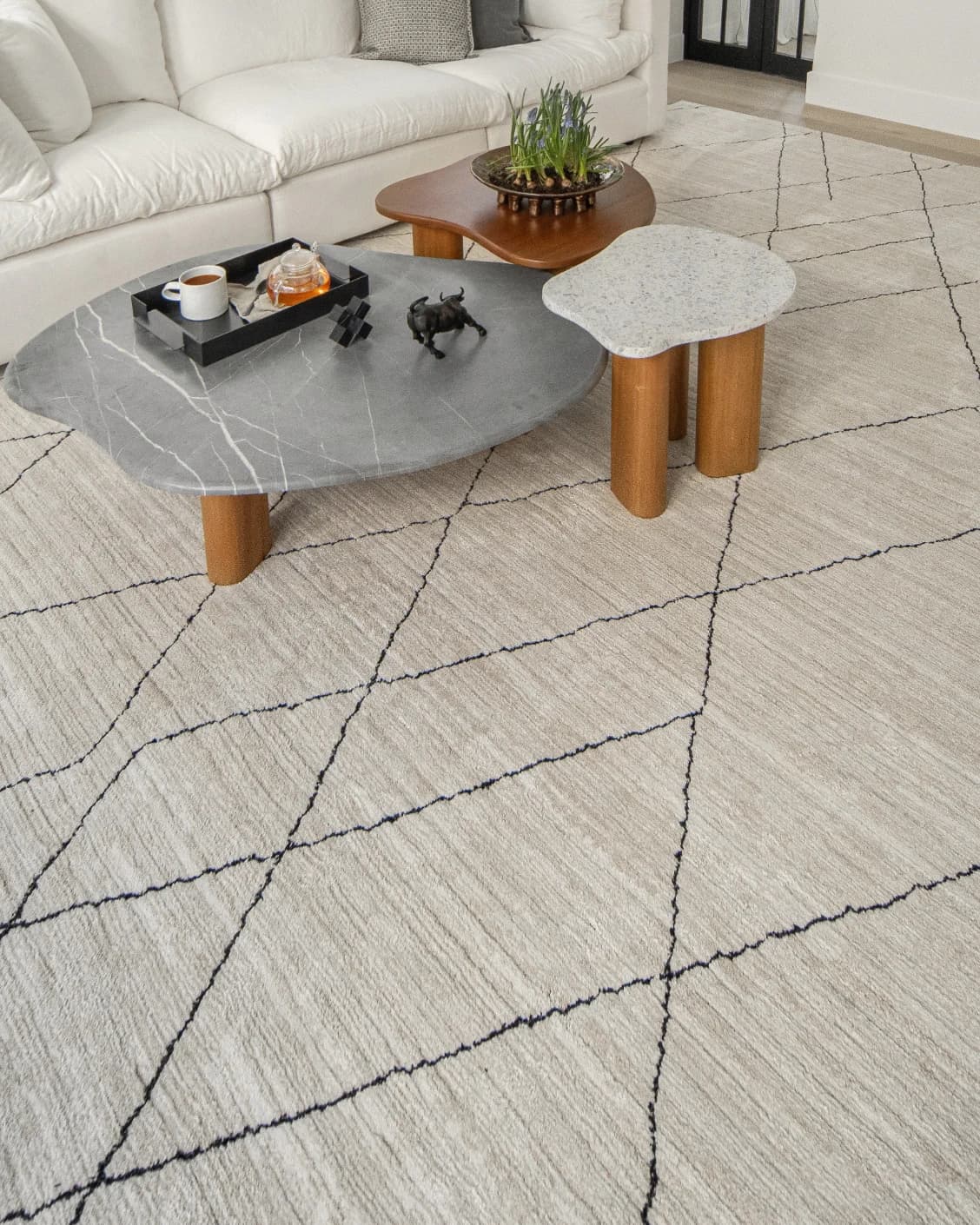 Zen Pearl carpet in charcoal and ivory, shown in a lifestyle left view as image 8