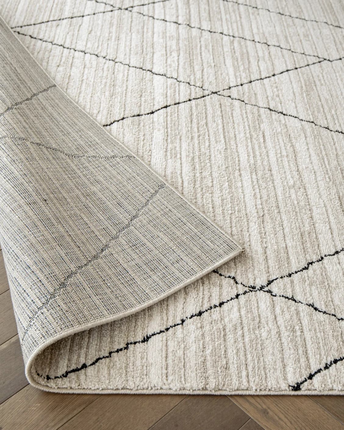 Zen Pearl carpet in charcoal and ivory, shown in a product close-up as image 11