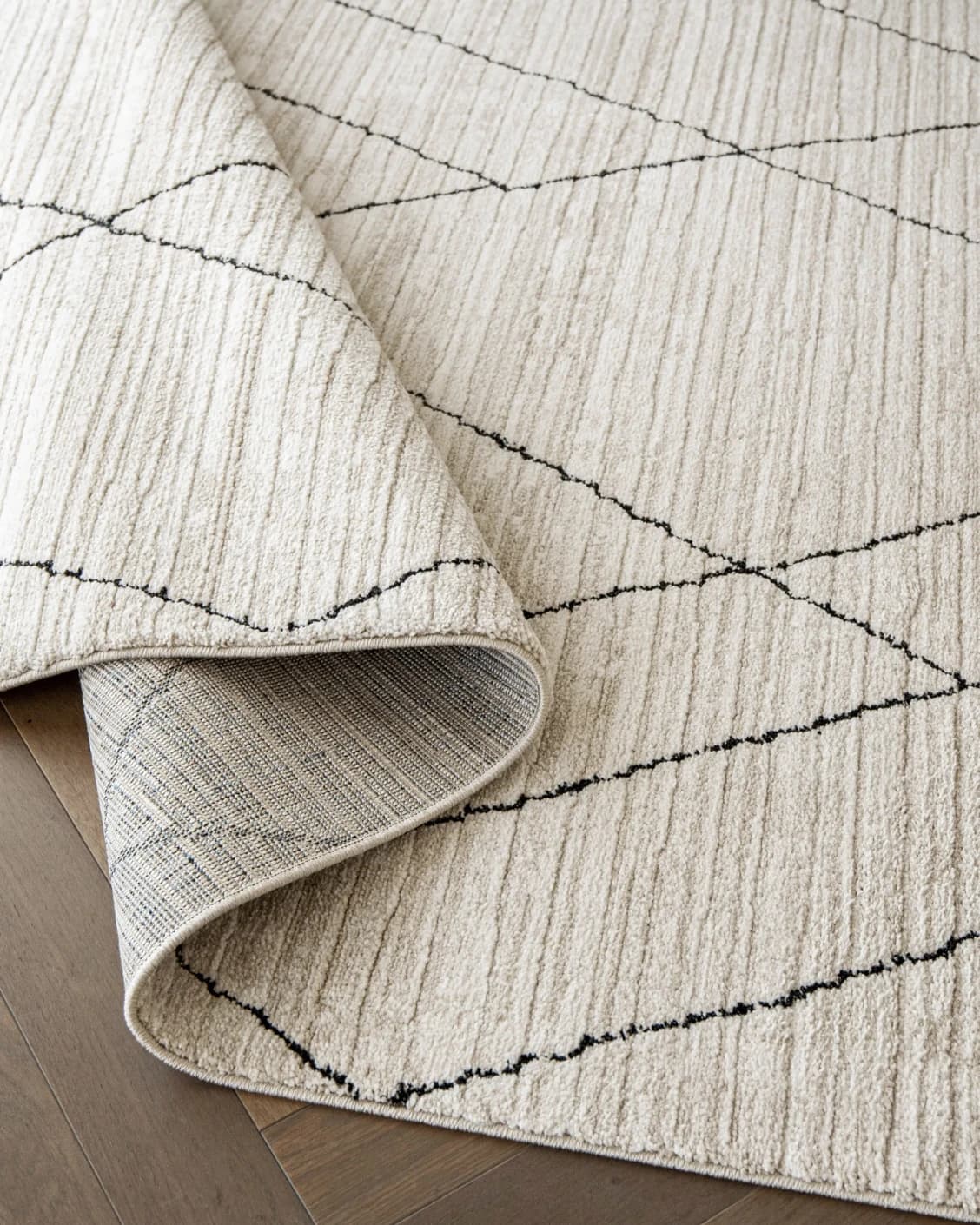 Zen Pearl carpet in charcoal and ivory, shown in a product close-up as image 12