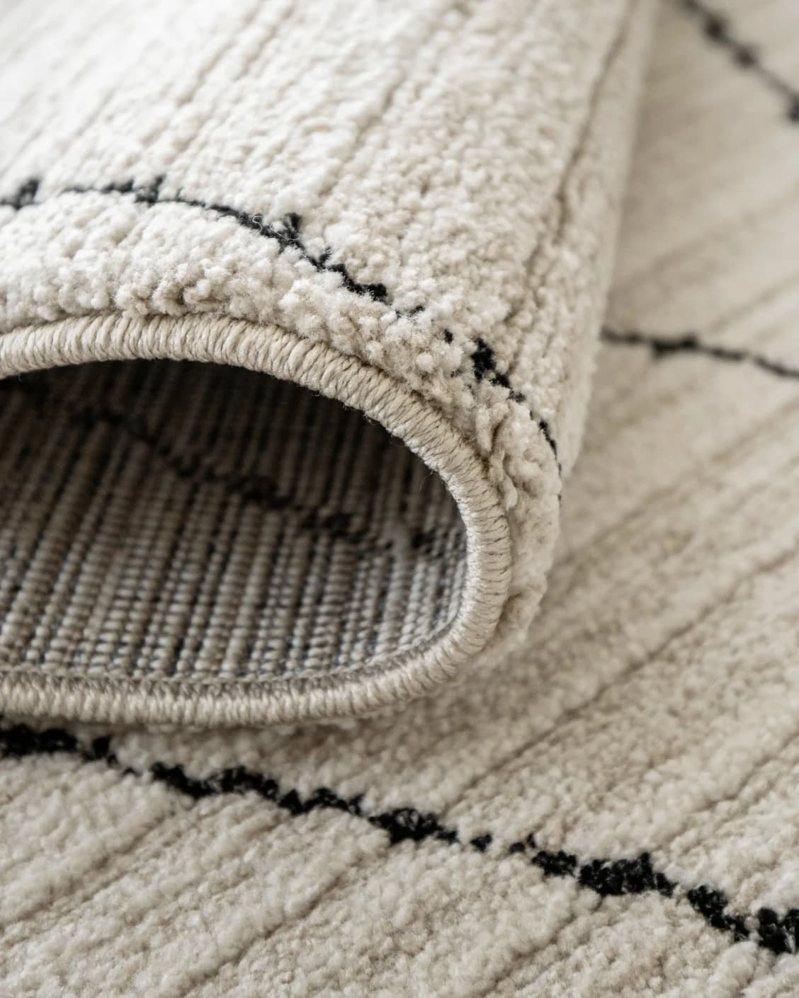 Zen Pearl carpet in charcoal and ivory, shown in a product close-up as image 13