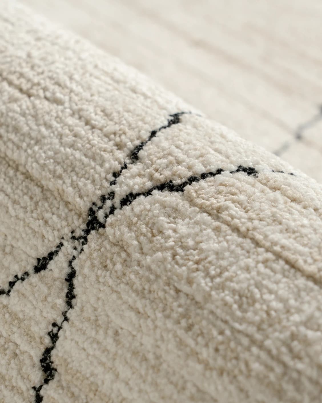 Zen Pearl carpet in charcoal and ivory, shown in a product close-up as image 14