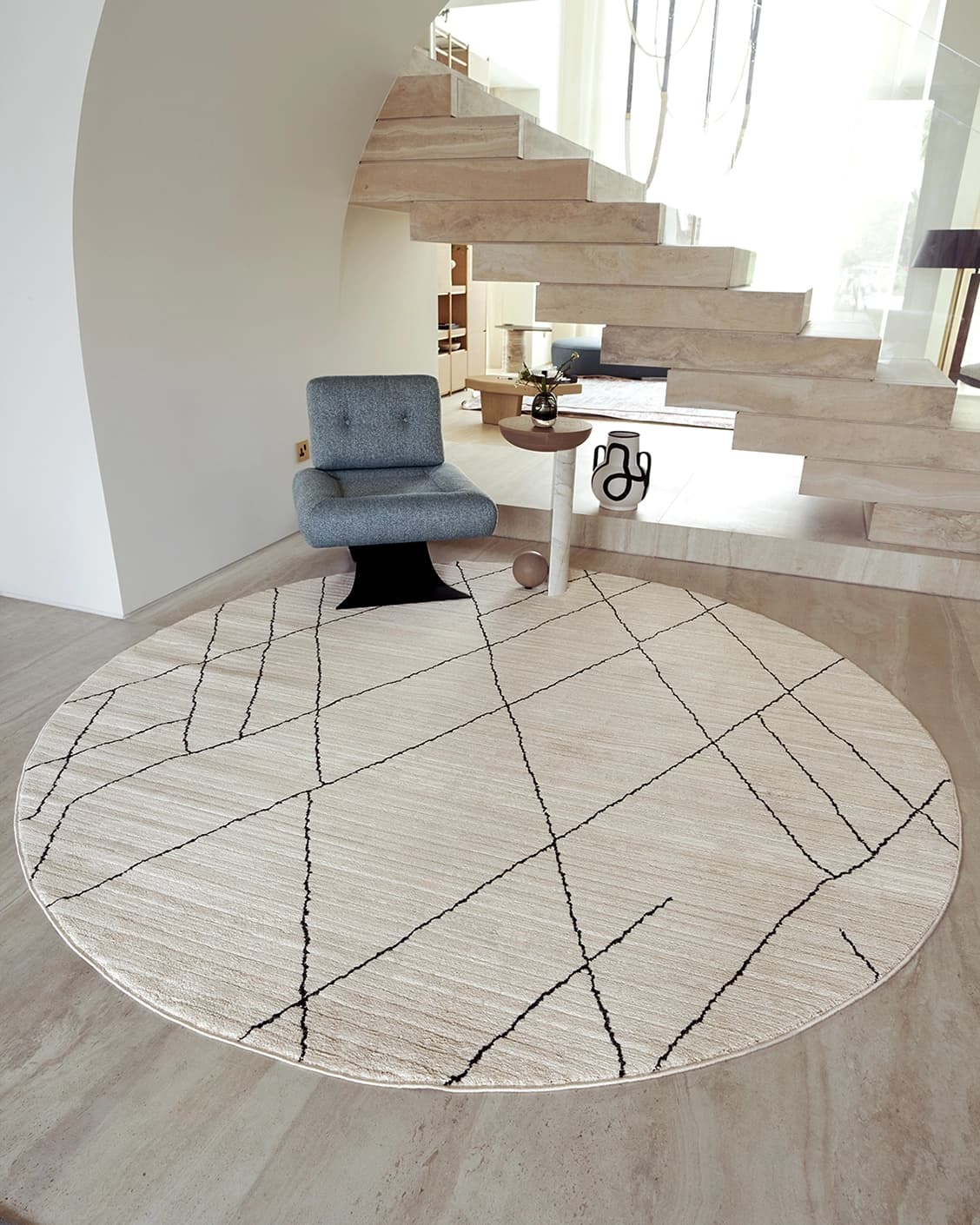 Zen Pearl Round carpet in pearl, charcoal and ivory, shown in a lifestyle front view as image 2