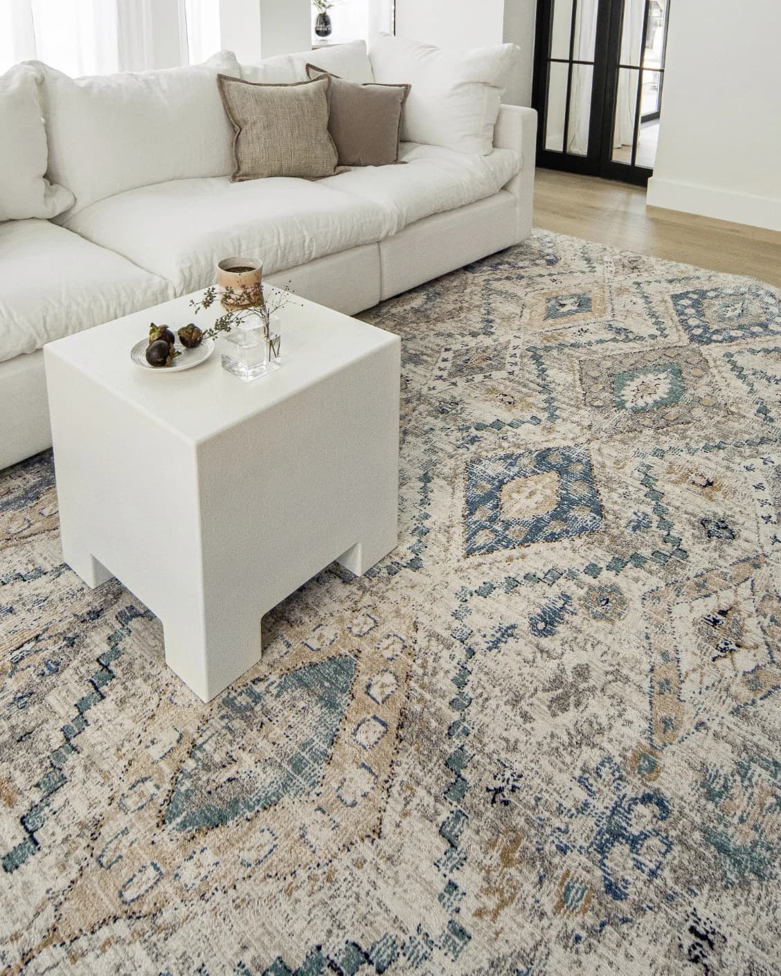 Zen Sandy carpet in beige and blue, shown in a lifestyle left view as image 8