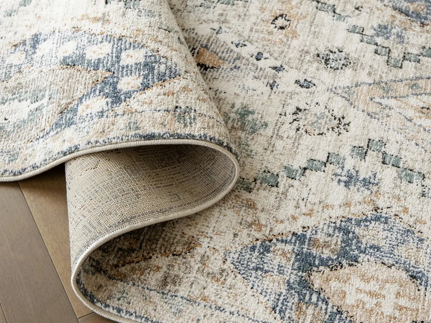 Zen Sandy Runners carpets in sandy, beige and blue, shown in a product close-up view