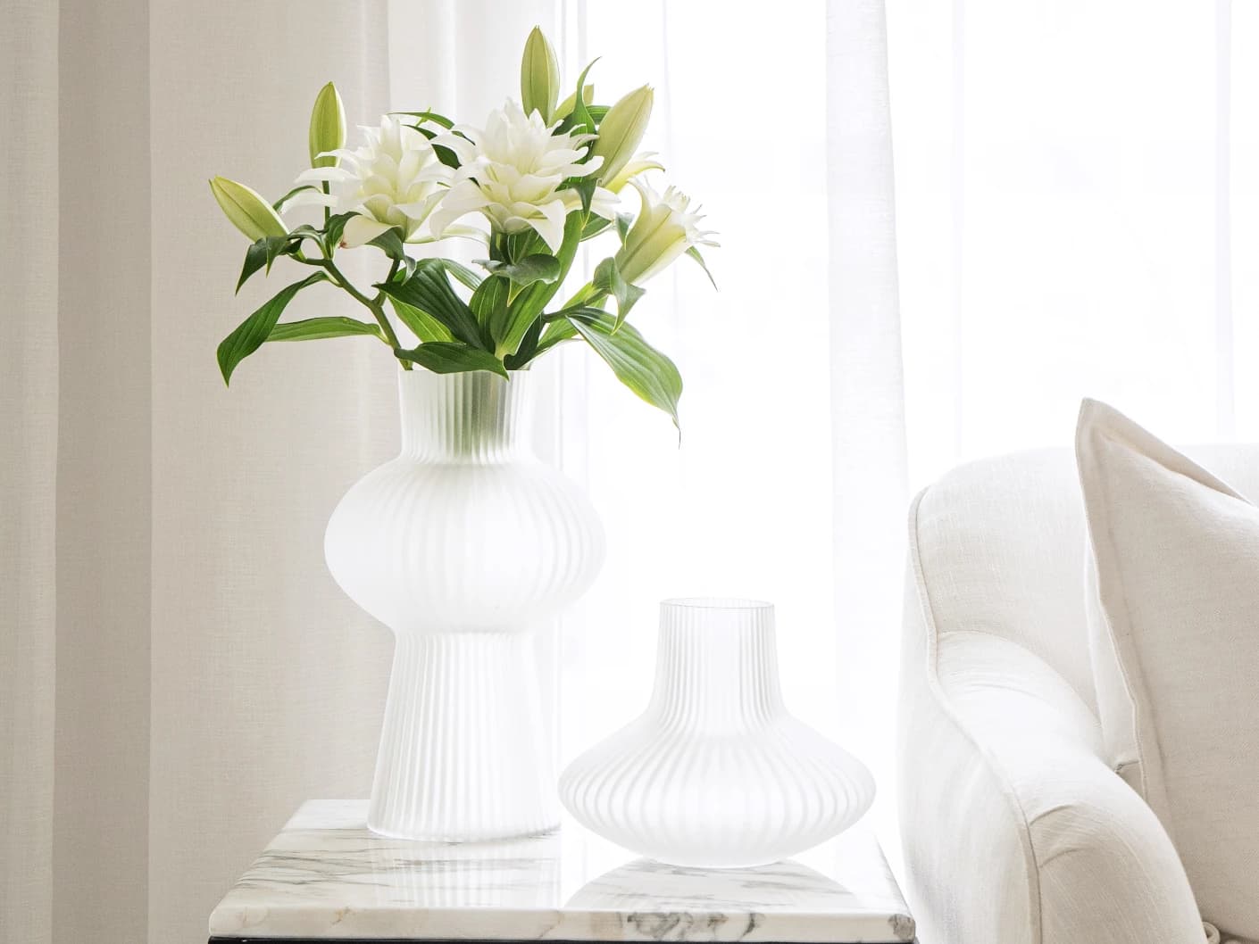 Zenya Bundle vases in white, shown in a lifestyle front view