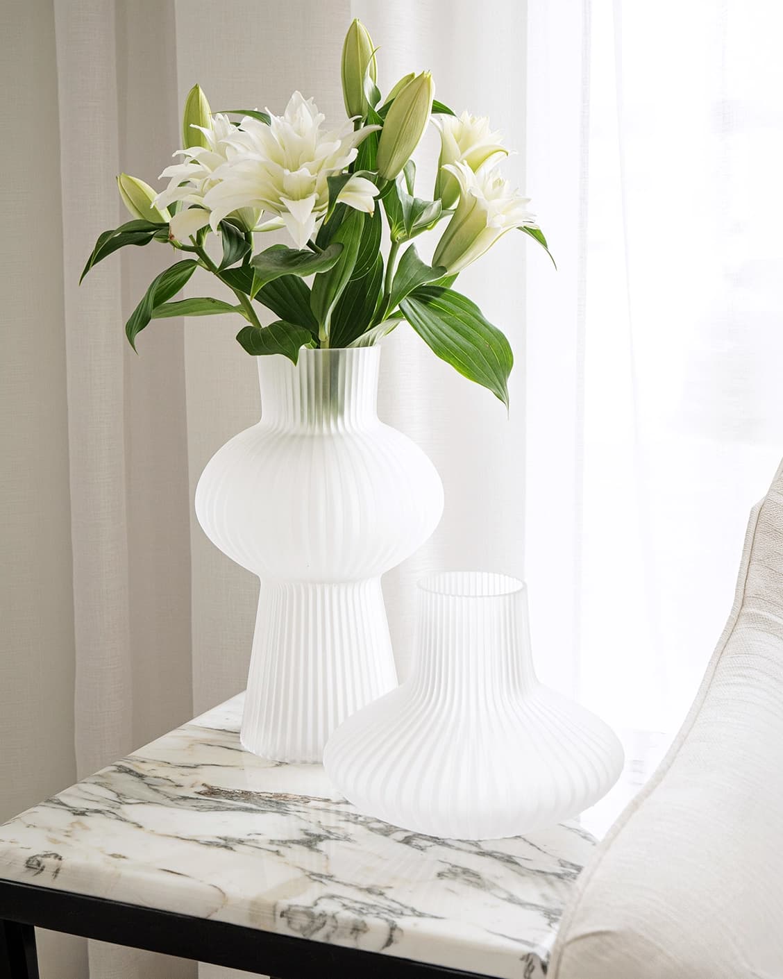 Zenya Bundle vases in white, shown in a lifestyle front view as image 2