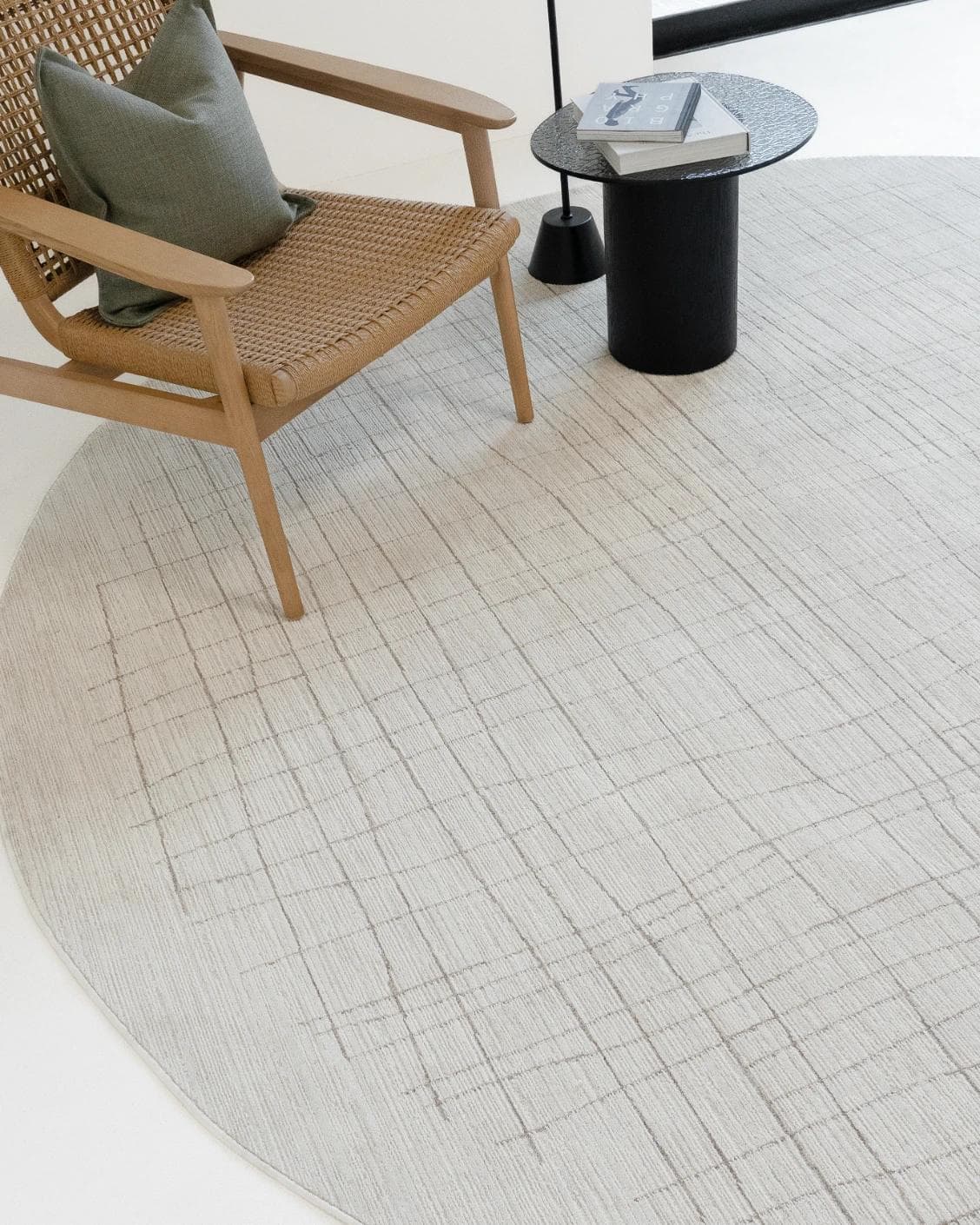 Zion Sandy Round carpet in ivory, shown in a lifestyle top view as image 4