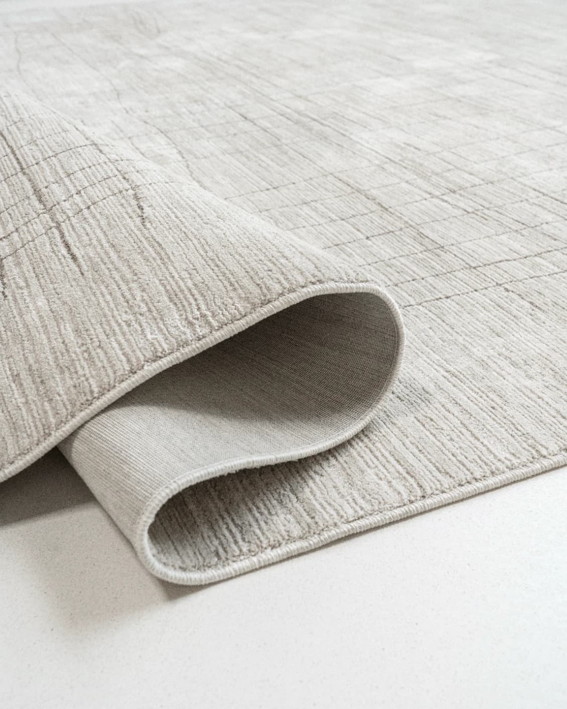 Zion Sandy carpets in ivory, shown in a product close-up as image 1