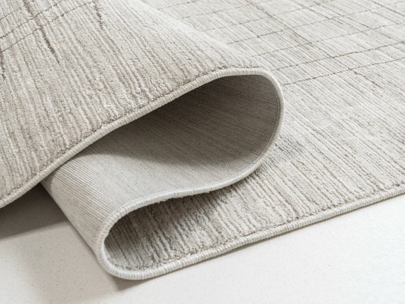 Zion Sandy Round carpets in sandy and ivory, shown in a product close-up view