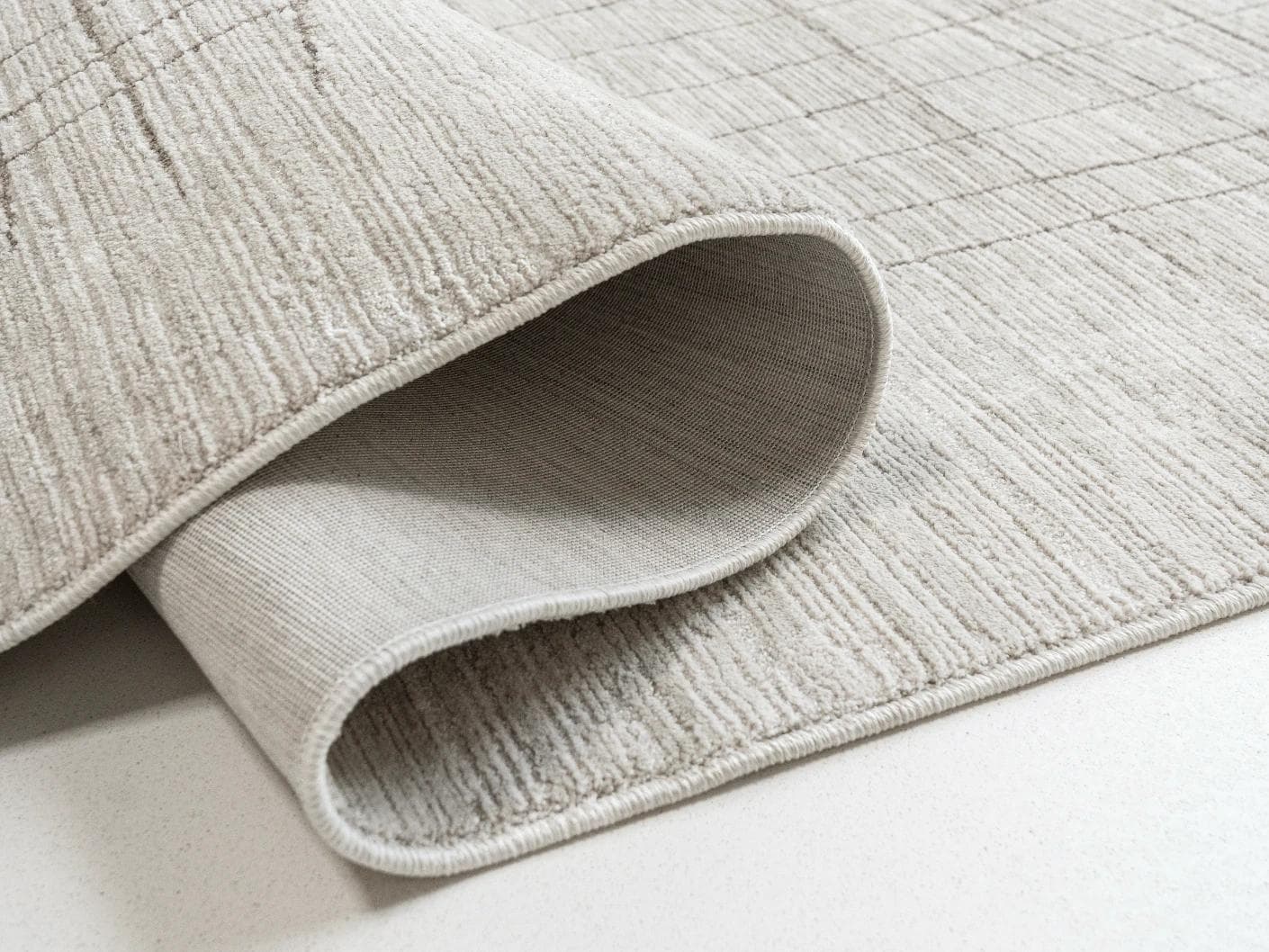 Zion Sandy carpets in ivory, shown in a product close-up as image 1