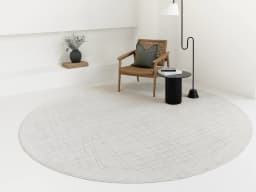 Zion Sandy Round carpet in ivory, shown in a lifestyle front view