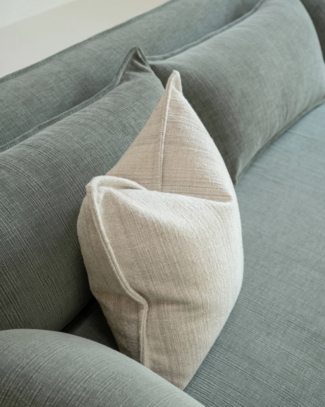 Zoe Laurent cushion in beige, shown in a lifestyle top view as image 5