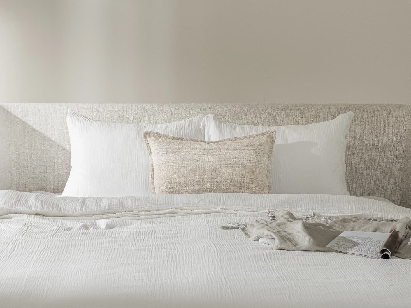 Zoe Laurent III single cushions in beige, shown in a lifestyle front view