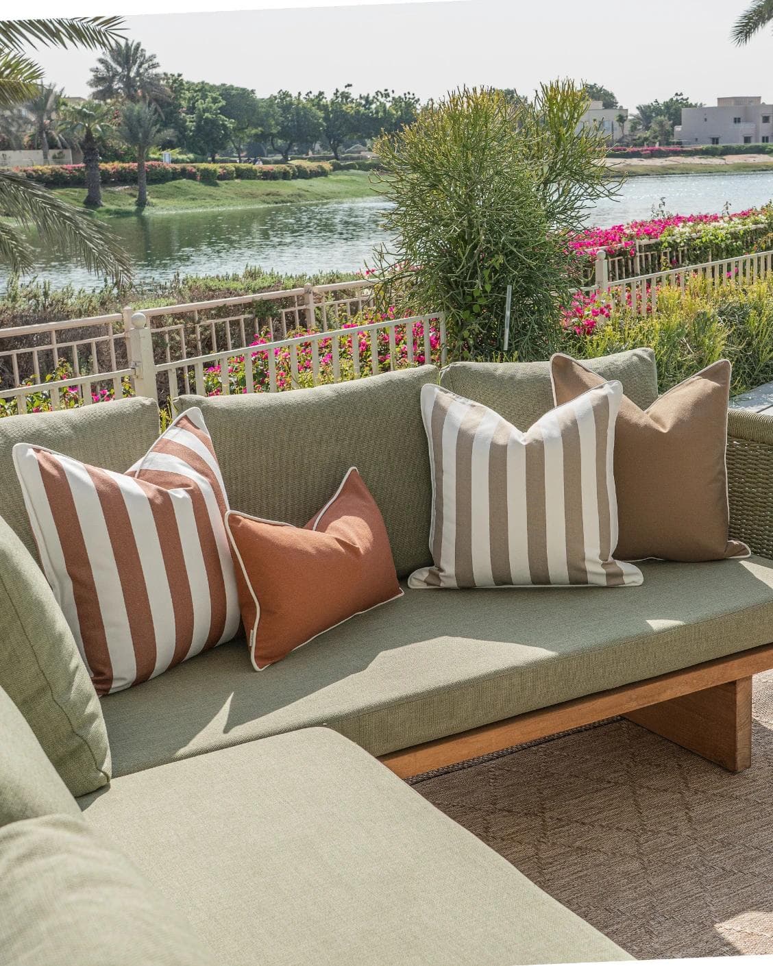 Imani Bundle cushion in brown and rust, shown in a lifestyle left view as image 2